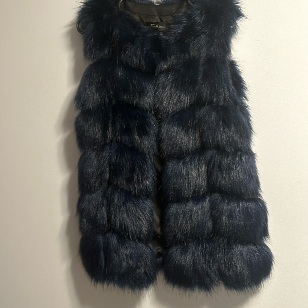 Bleu vest with tag ,Machine wash ,No dry clean,